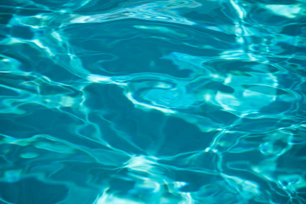 istock Ripple Water in swimming pool with sun reflection. Wavy water background. 2179777551