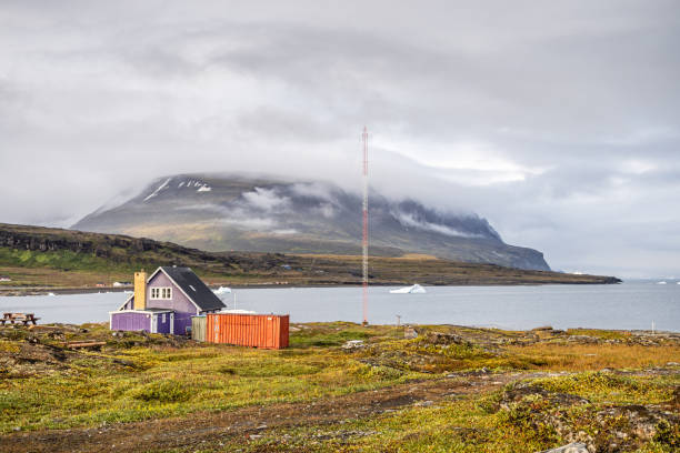 Qeqertarsuaq, Godhavn, Disko Island, Greenland, Denmark - August 24th 2024:  Typical arctic residential building in Greenland - with a view to the famous flat mountain on Disko Island