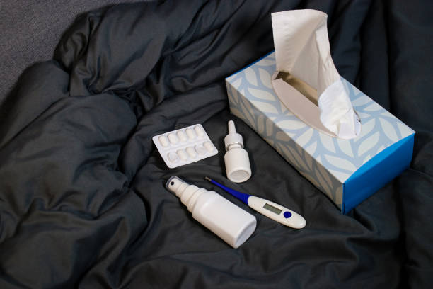 istock Home medicine stuff for flues on a grey blanket at home 2179783176