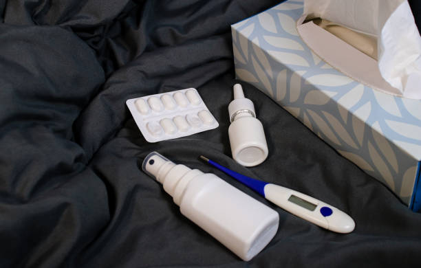 istock Home medicine stuff for flues on a grey blanket at home 2179783187