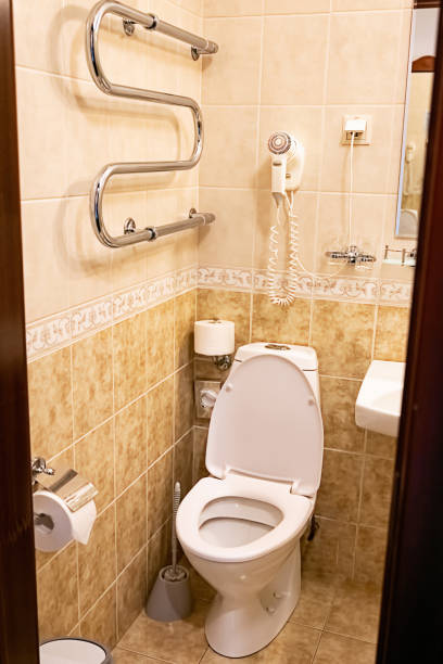 istock Clean bathroom with white toilet and tiled walls. 2179785411