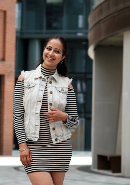 istock Beautiful indian woman smiling outdoors in urban setting 2179786847