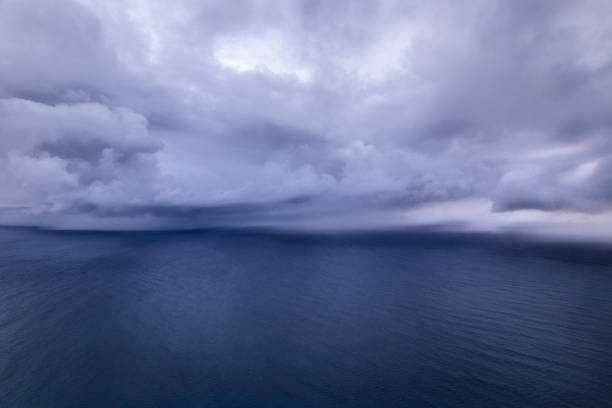 istock Heavy storm clouds gathering over the the ocean's surface 2179787132