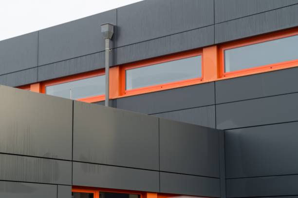istock Modern building facade featuring black and orange panels 2179793670
