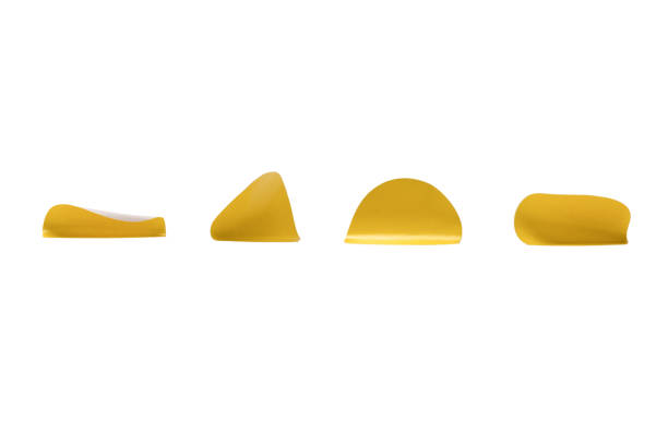 Round yellow stickers, blank tags labels isolated on a white background. Top view.