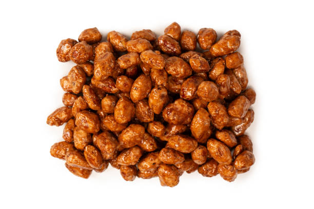 istock Tasty sweet roasted peanuts isolated on a white background. 2179802685