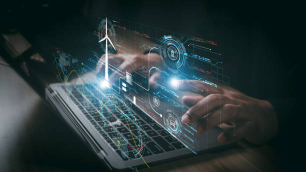 istock Businessman using laptop with Alternative energy for the future concept,Wind turbines change wind energy into electrical energy, Renewable energy engineer working on a laptop. 2179806042