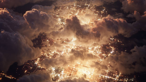Flying Over Bright City Lights - Cumulus Clouds At Night - Infrastructure, Power Generation, Climate Change