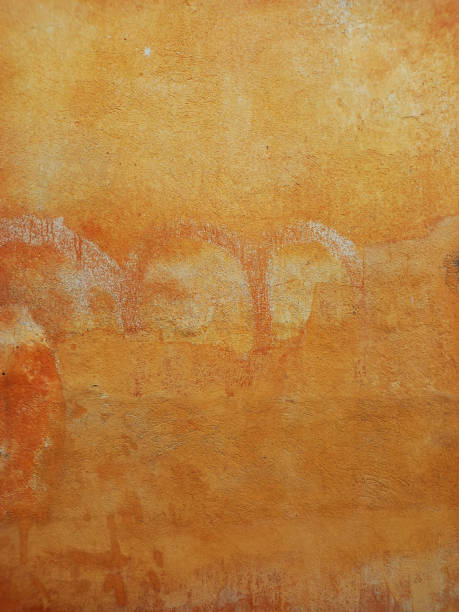 istock Peeling paint and rusty old metal background. Mustard colored rusty metallic abstract background. Patterns and texture. 2179807269