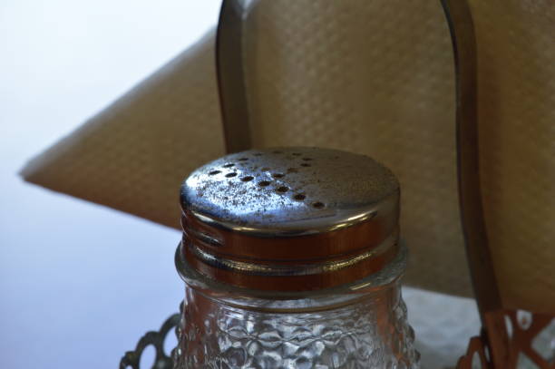 istock Pepper shaker on table against white napkin 2179810646