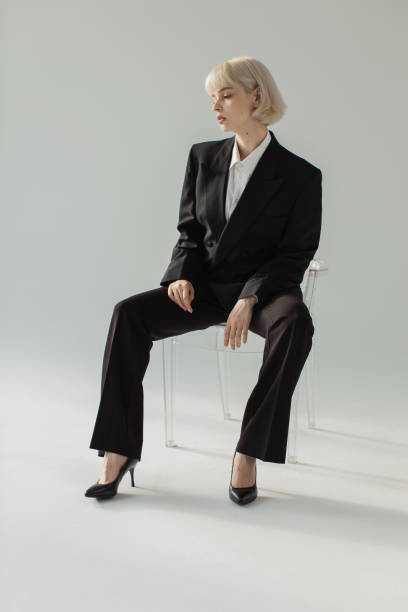 istock Fashion model in black suit in studio. 2179811137