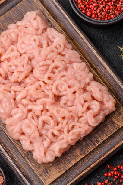 istock Fresh raw chicken mince with salt, spices and herbs 2179811967