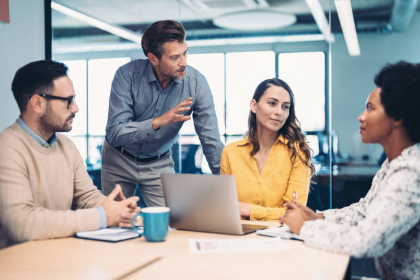 istock Group of business persons having a discussion 2179813314