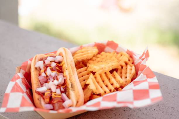istock Hot dog and milkshake set on the stone with a blurry background 2179817280