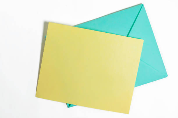 istock Colorful Envelopes and Blank Card on White Background, perfect for invitations or greetings. Top view 2179821500