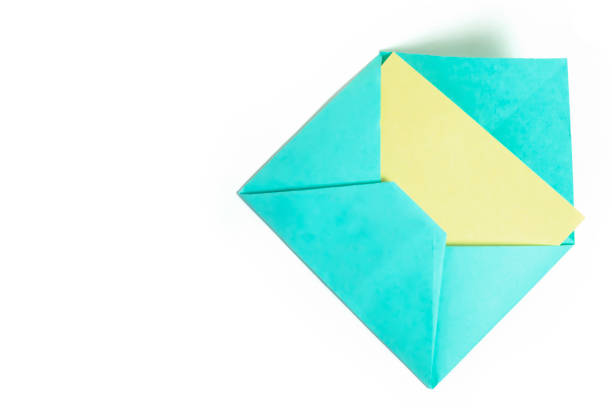 Envelope with yellow paper sheet isolated on white background