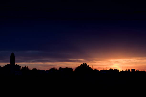 istock silouette of bell tower at sunset 2179830528