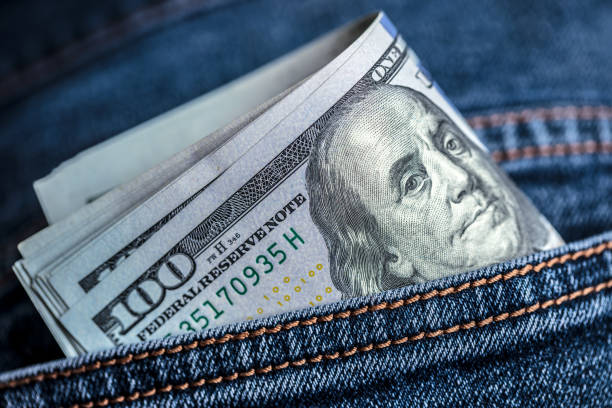 istock Dollar bills in jeans pocket 2179831957