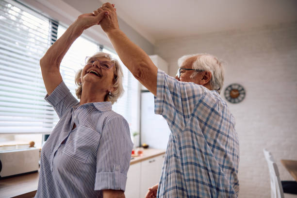 istock Carefree senior couple dancing in the kitchen. 2179832125