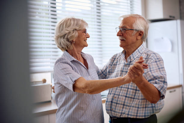 istock Happy retired couple dancing in the kitchen. 2179832133