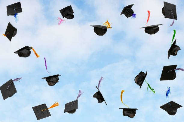 istock Graduation caps thrown in the sky 2179832362