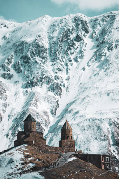istock Gergeti Trinity Church with Majestic Snowy Mountain Backdrop, Georgia 2179834487