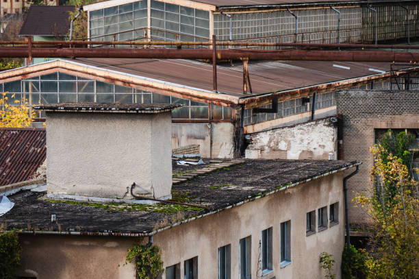 istock Old industrial buildings with rusted pipes and chimney 2179835204