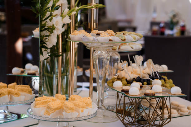 istock Elegant Dessert Buffet Display with Assorted Pastries and Floral Arrangement 2179835908