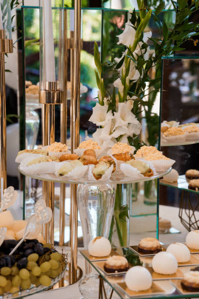 istock Elegant Dessert Display with Floral Decor and Assorted Pastries at Luxury Event 2179835957