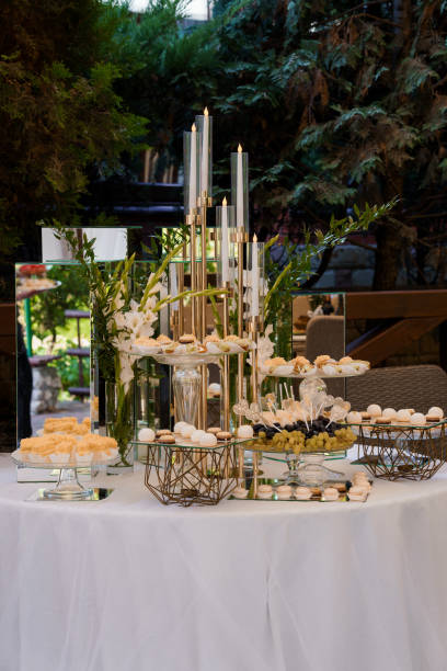 istock Elegant Dessert Table Setting with Candles and Greenery at Outdoor Event 2179835993