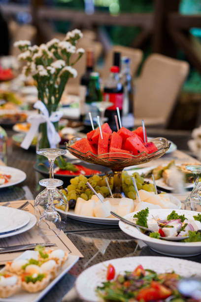 istock Exquisite Summer Banquet: Vibrant Table Setting with Fresh Fruits and Elegantly Arranged Dishes 2179836004