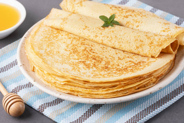 istock Stack of traditional russian pancakes blini on gray background with copy space. Homemade russian thin pancakes blini. Russian food, russian kitchen 2179838307