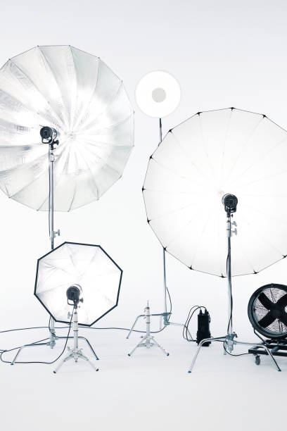 Photo studio equipment on a white background with soft lights. Technical equipment on a white background in the studio. Studio photography, advertising and fashion photography, no people