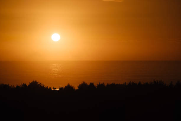 Beautiful orange sunset over the Oregon coast glow and reflections