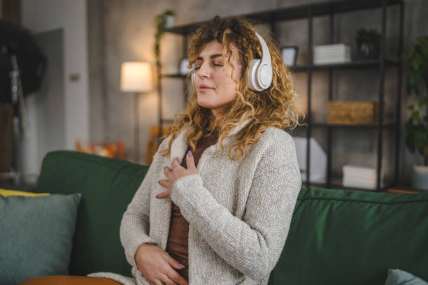 istock one woman doing guided meditation yoga self care practice at home 2179846183
