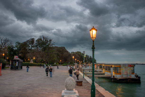 Venice Italy 9 October 2024:Venice navigation ferry stop with street lamps on