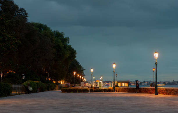 Venice Italy 9 October 2024:Venice navigation ferry stop with street lamps on