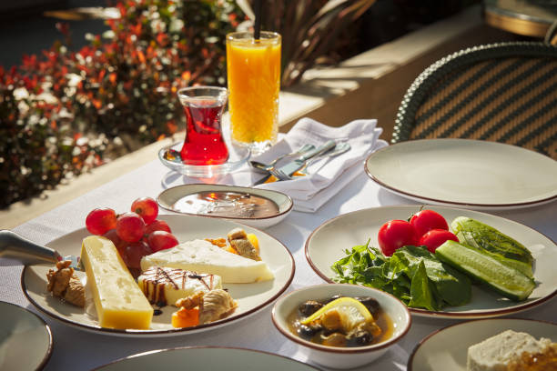 istock The famous Turkish breakfast table, rich and varied. A traditional breakfast table with foods specific to Turkish cuisine such as börek, simit, tea, orange juice, honey and clotted cream. 2179850536