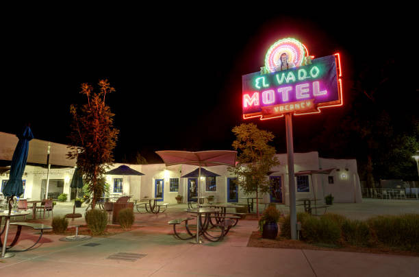 Albuquerque, New Mexico, USA - September 25, 2024: A glowing neon sign welcomes visitors to the El Vado Motel, a historic motor lodge on Route 66 in Albuquerque's Old Town.