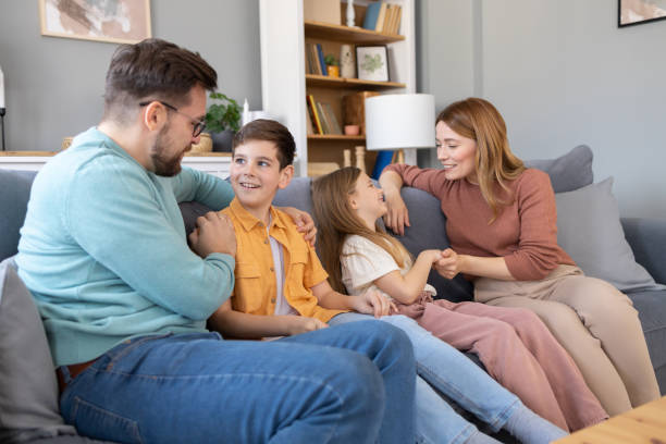 istock Family laughing together on a comfy sofa 2179859214