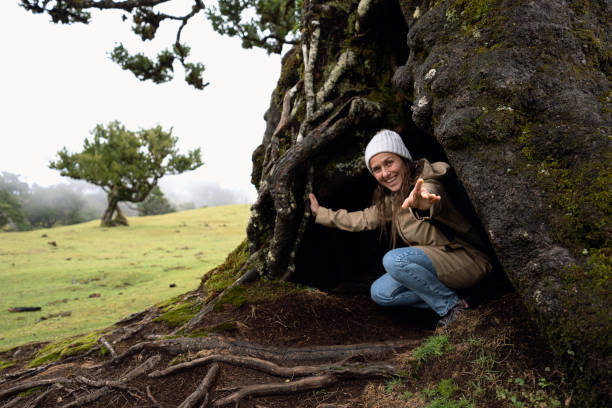 istock Come Here with Me! Woman Hidden in Big Fantasy Tree. 2179859721
