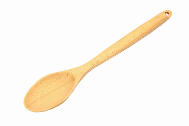 istock Light wooden spoon isolated on white background 2179859860