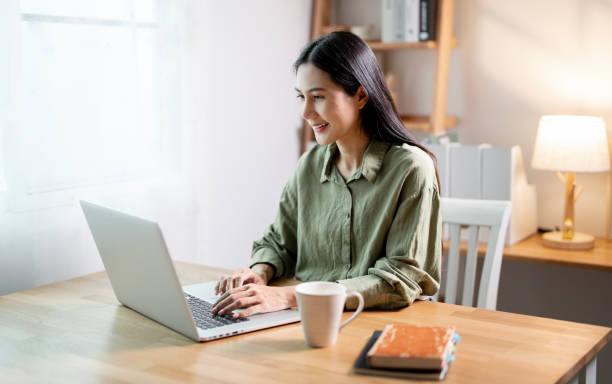 istock Creative young woman working on laptop in her studio 2179864380