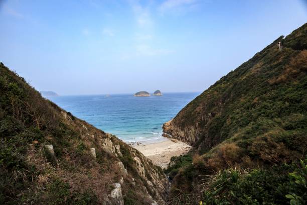 istock Secluded Cove with Pristine Beach and Distant Islands 2179870411