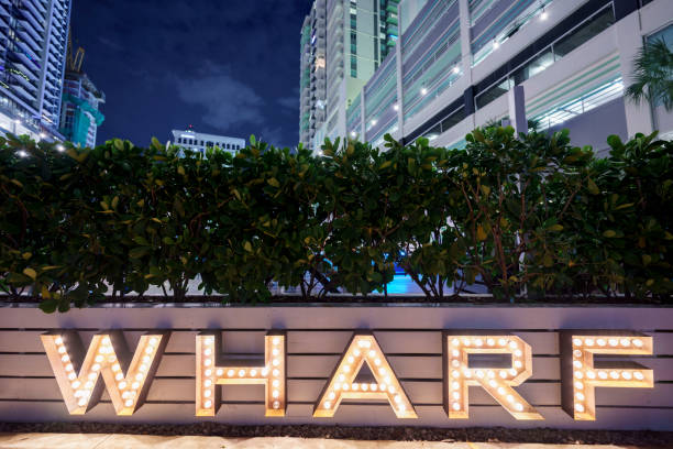 istock Word Wharf  lights at night 2179878944