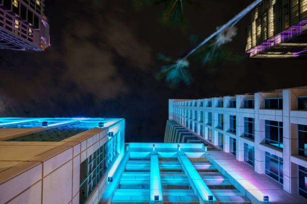 istock Neon lights in the city looking up 2179878948