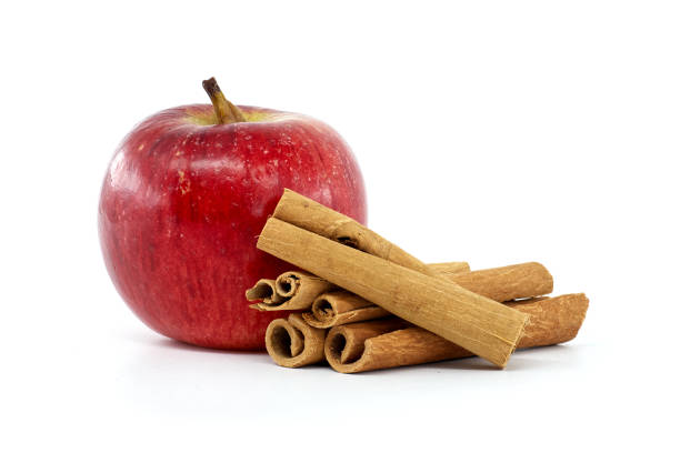 Apple fruit in basket and cinnamon sticks still life