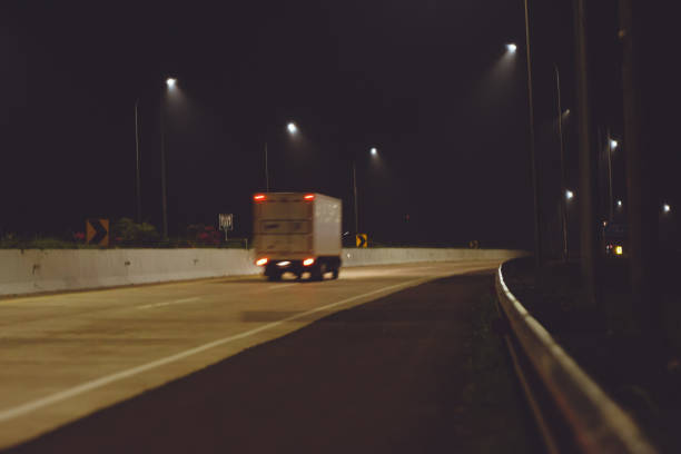 istock A box-type vehicle that drives on the highway at night 2179883472