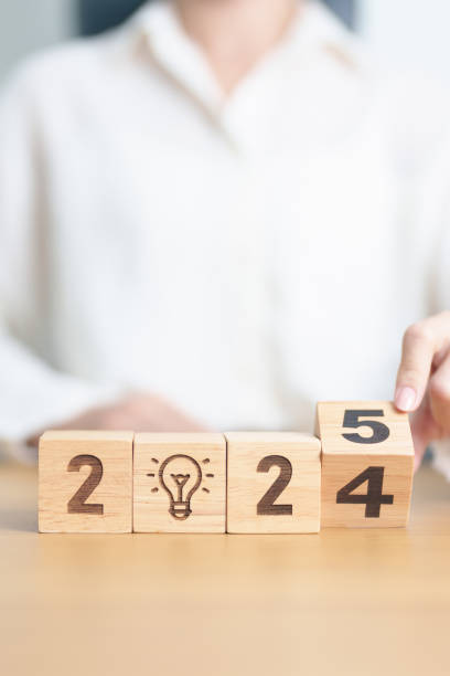 istock 2024 year change to 2025 year block with lightbulb. Business Idea, Creative, Thinking, brainstorm, Goal, Resolution, strategy, plan, Action, change and New Year start concepts 2179887914