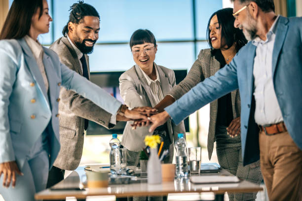 istock Business team celebrating success with raised hands 2179895149